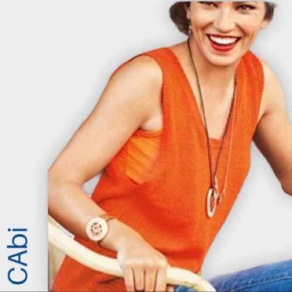 Orange, sleeveless CAbi blouse. Size medium.
